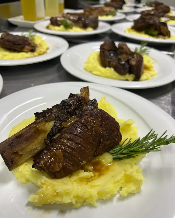 Close-up short rib on the bone over mashed potato