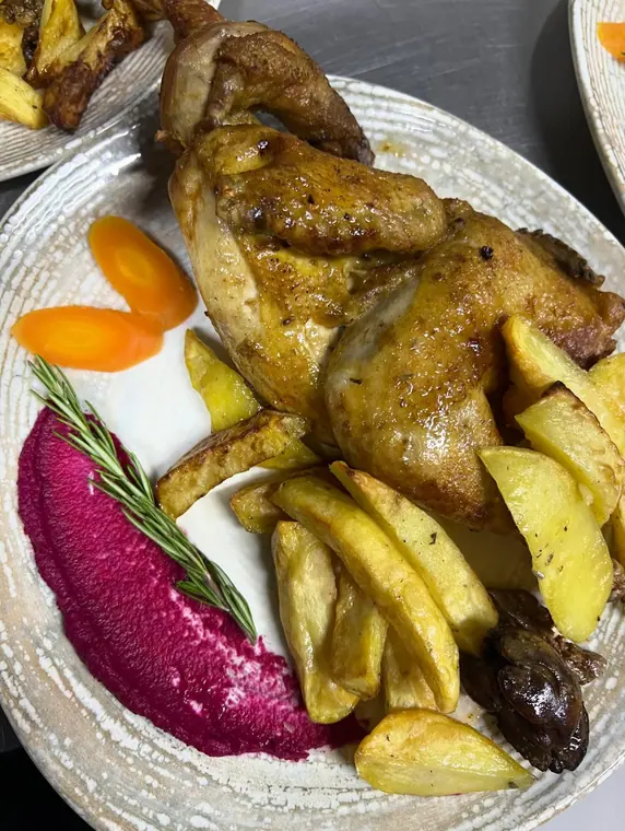 Roast chicken with potato wedges, beetroot puree and carrot slices