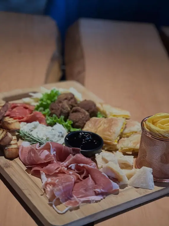 Sharing board on wooden restaurant table