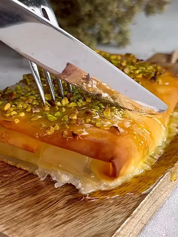 Syrup-soaked pastry topped with chopped pistachios